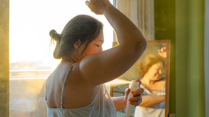 woman-applying-deodorant-on-underarm